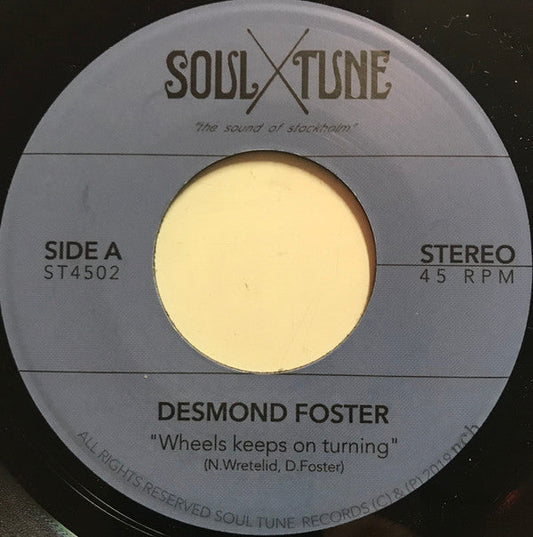 Desmond Foster - Wheels Keeps On Turning | Mint (M) Generic-Music History